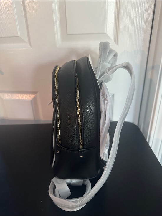 black mk backpack leather straps Michael Kors Brooklyn 13 recycled polyester while the interior boasts a back zip pocket for additional organization Rhea Medium Pebbled Leather Backpack